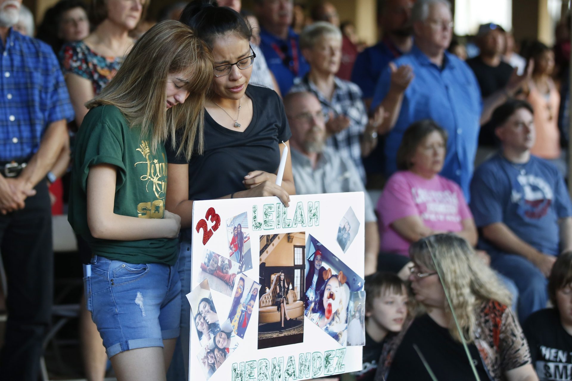High School students Celeste Lujan, left, and Yasmin Natera, right, mourn their friend, Leila Hernandez, one of the victims of the Saturday shooting in Odessa, at a memorial service Sunday, Sept. 1, 2019, in Odessa, Texas. 