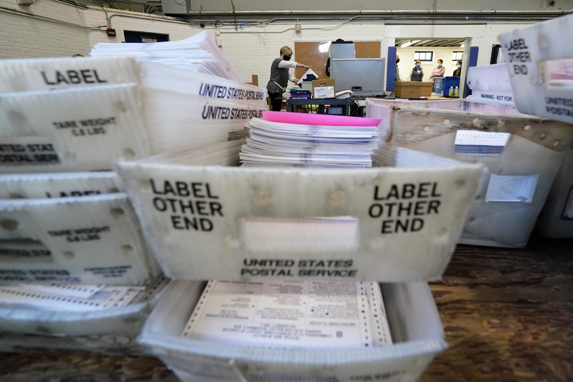 Chester County election workers scan mail-in and absentee ballots for the 2020 general election in the United States at West Chester University, Wednesday, Nov. 4, 2020, in West Chester.