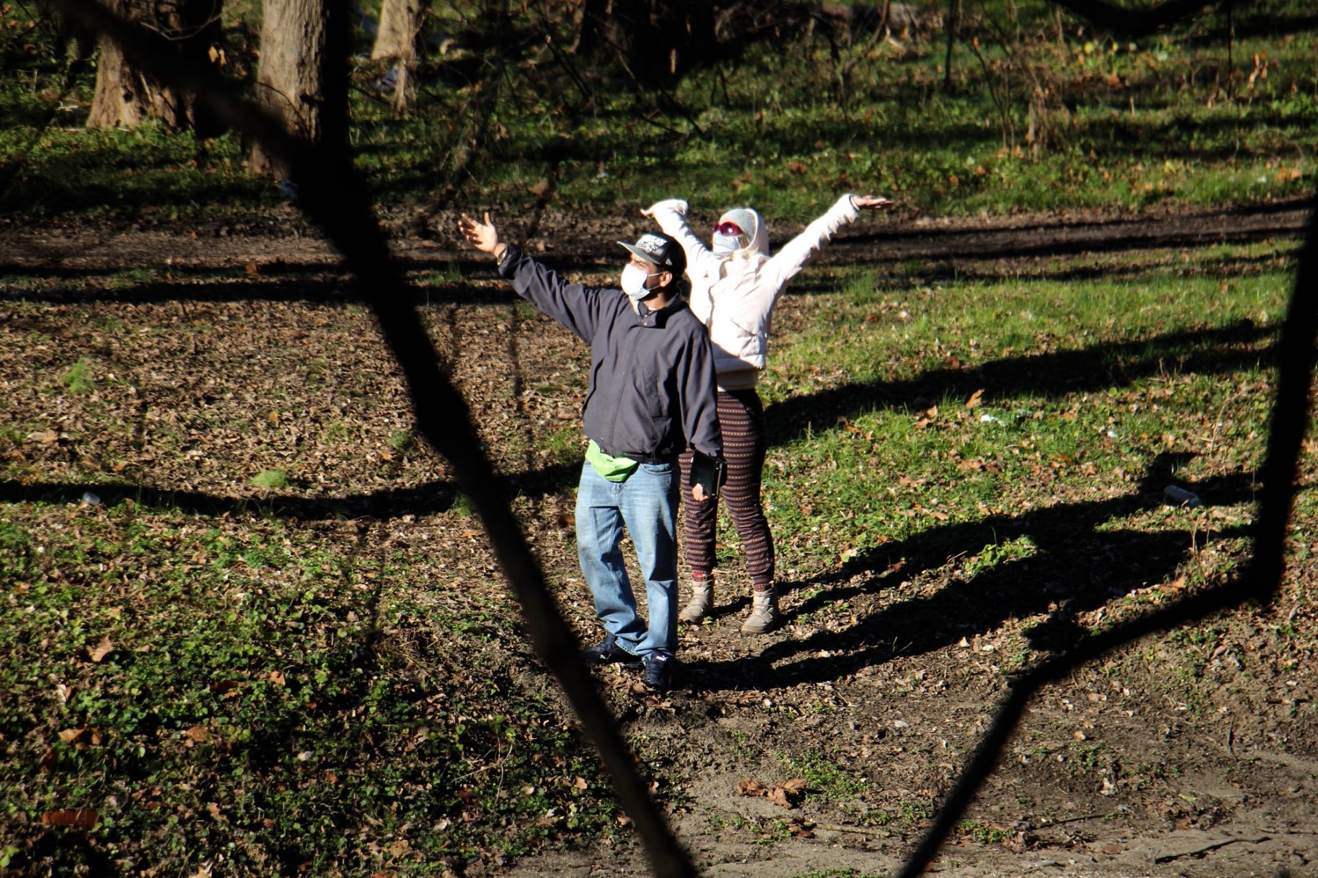 A couple celebrates the sunshine at Tacony Creek Park.