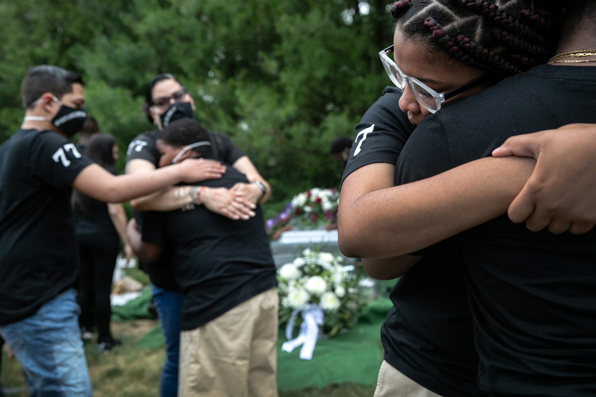 Family members mourn the death of Conrad Coleman Jr. at his burial on July 3, in Rye, N.Y. Coleman, 39, died of Covid-19 on June 20, just over two months after his father Conrad Coleman Sr. also died of the disease.