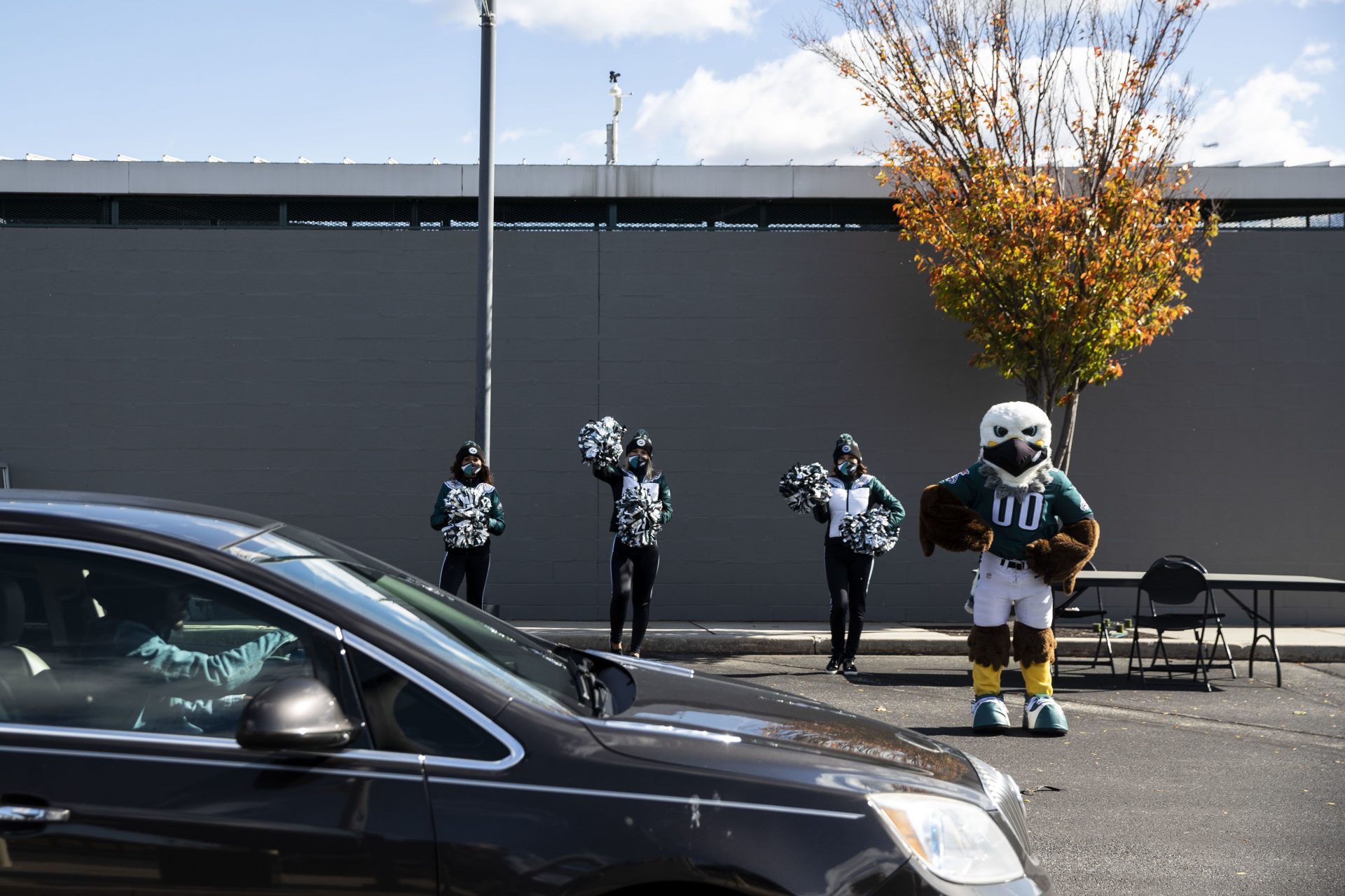 The Eagles mascot, Swoop, and team cheerleaders greeted voters dropping off their mail ballots at a satellite election office site at Lincoln Financial Field in Philadelphia on Nov. 2, 2020.