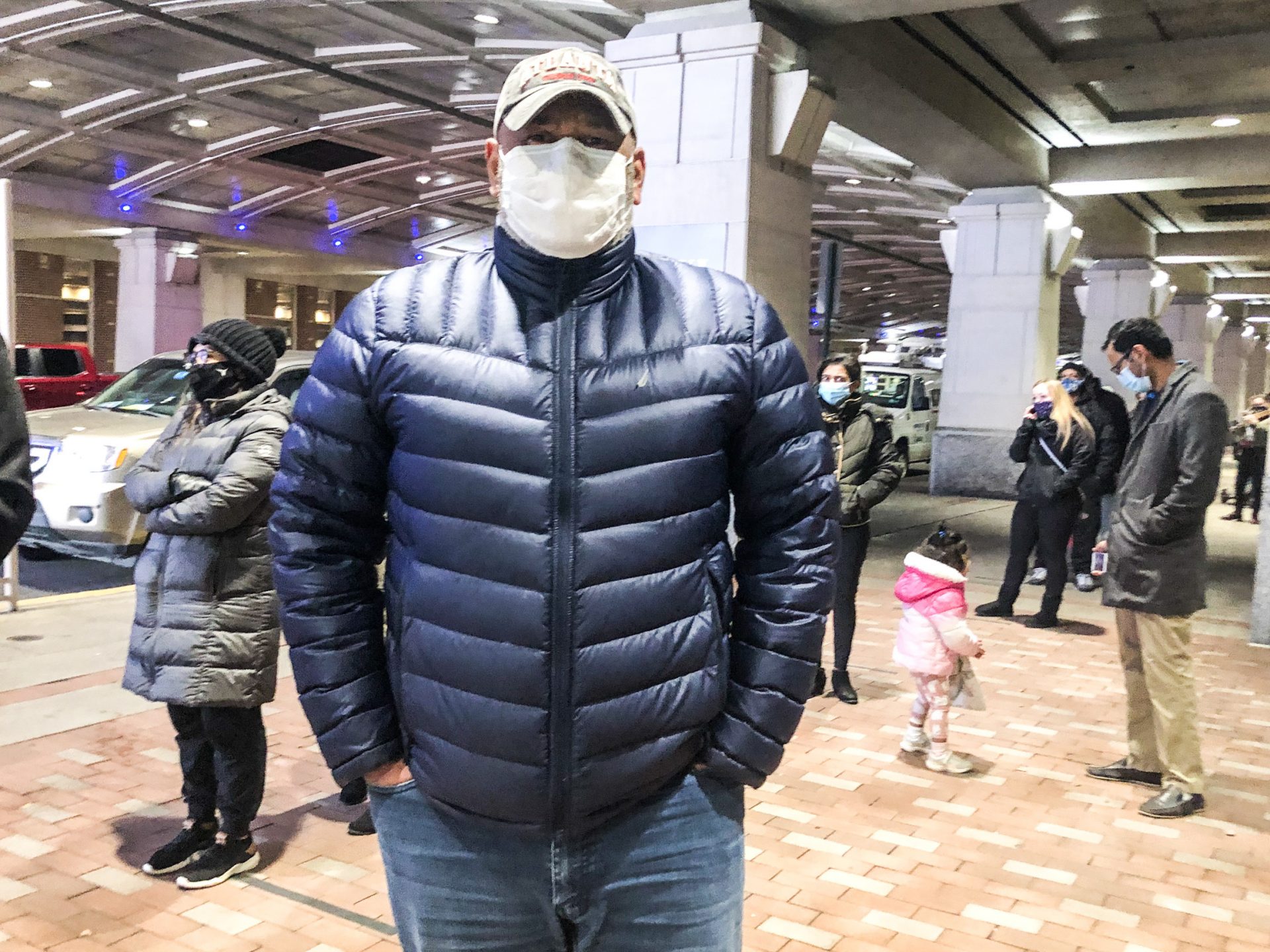 Julio Polanco, a behavioral care specialist at Children’s Crisis Treatment Center, stands in line at Philadelphia’s community vaccination clinic at the Pennsylvania Convention Center.