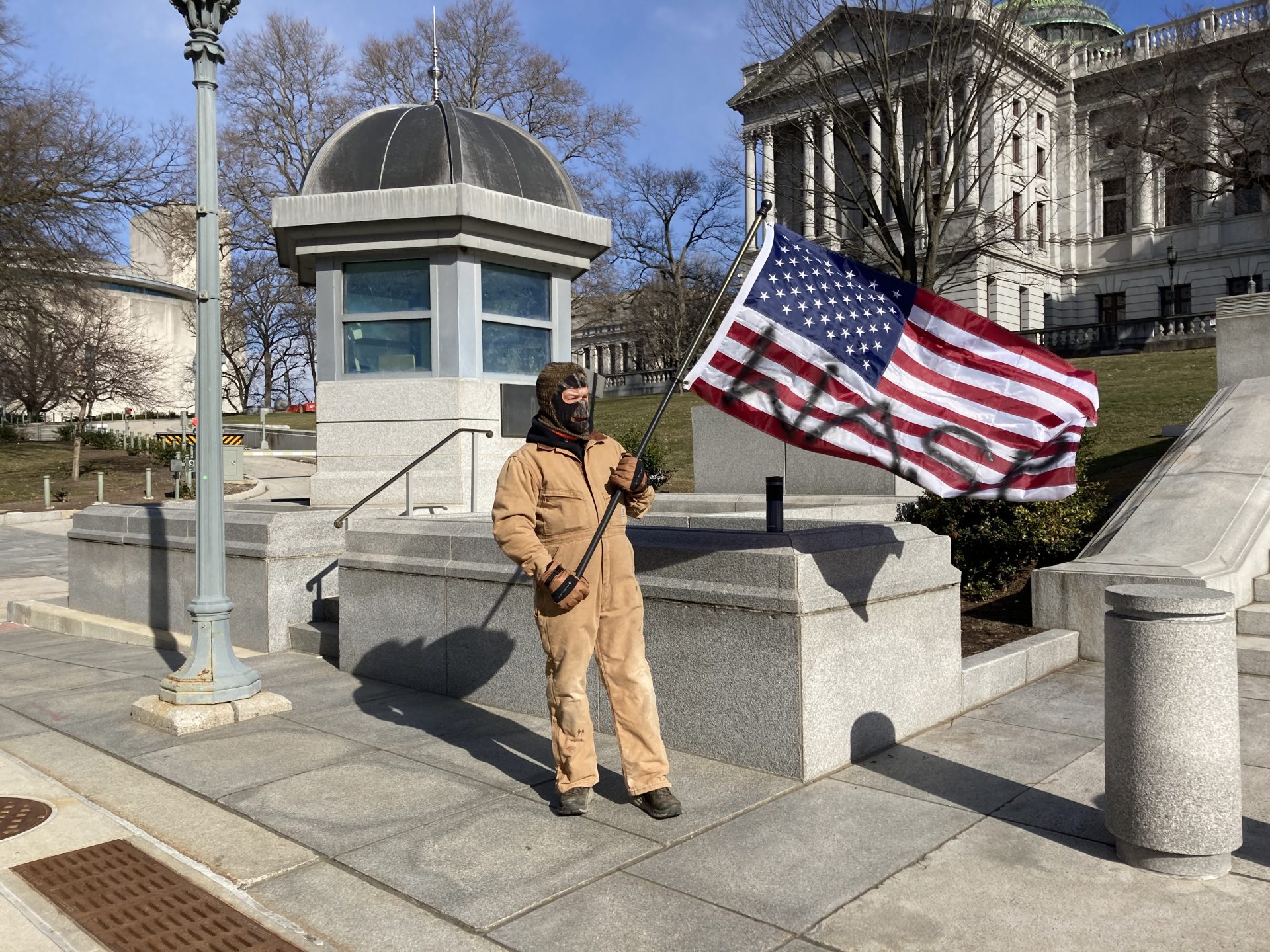 Ryan Stevenson stood outside the Pennsylvania Capitol during the inauguration of President Joe Biden on Jan. 20, 2021.