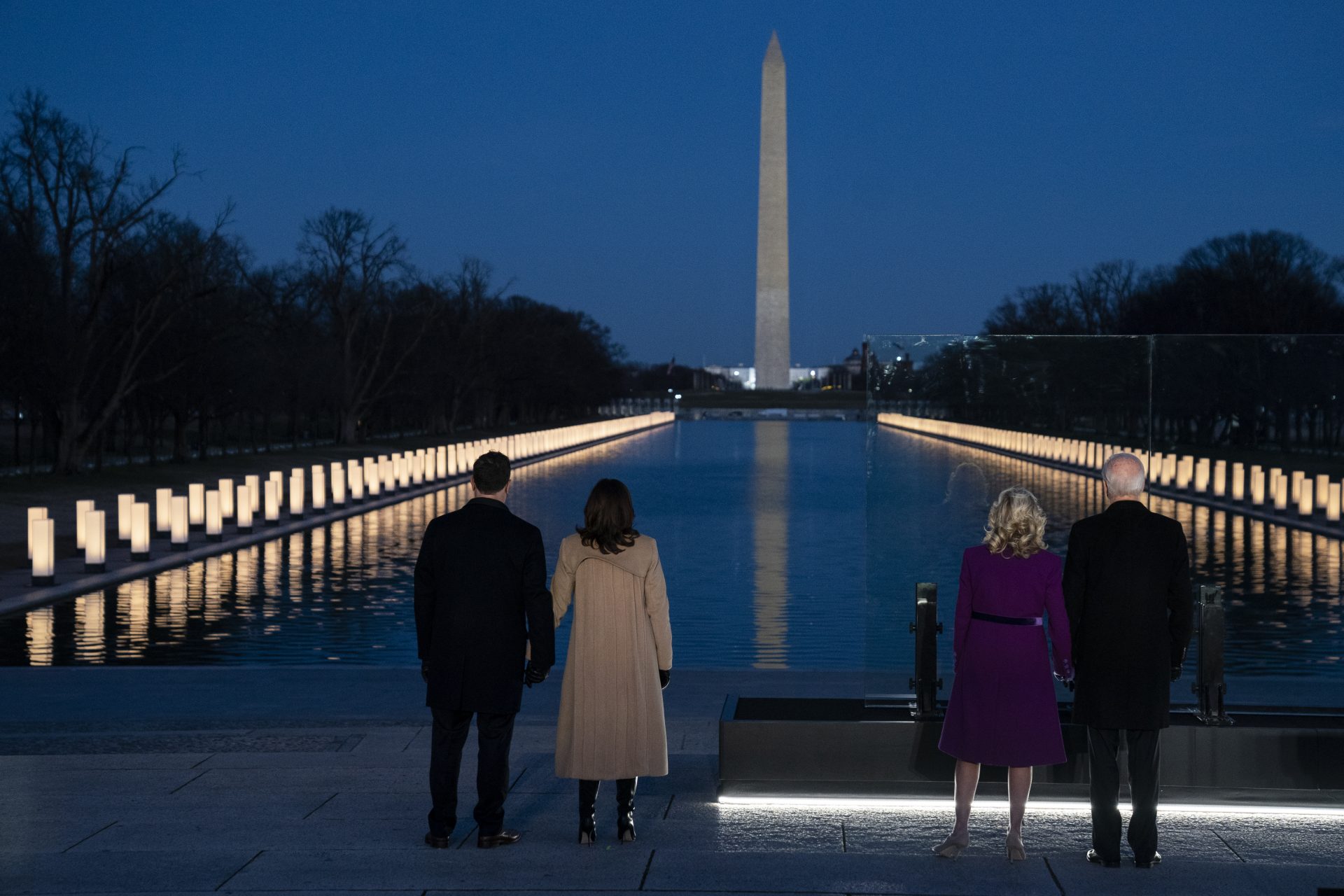President-elect Joe Biden and his wife Jill Biden are joined by Vice President-elect Kamala Harris and her husband Doug Emhoff to participate in a COVID-19 memorial event at the Lincoln Memorial Reflecting Pool, Tuesday, Jan. 19, 2021, in Washington.