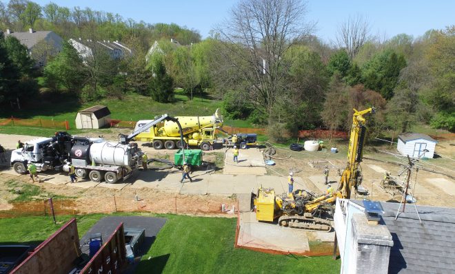 In this file photo, Mariner East 2 pipeline construction crews work in the backyards of homes on Lisa Drive in West Whiteland Township, Chester County, on May 2, 2018 after sinkholes opened in the area. That caused one of the ME2 project's many delays.