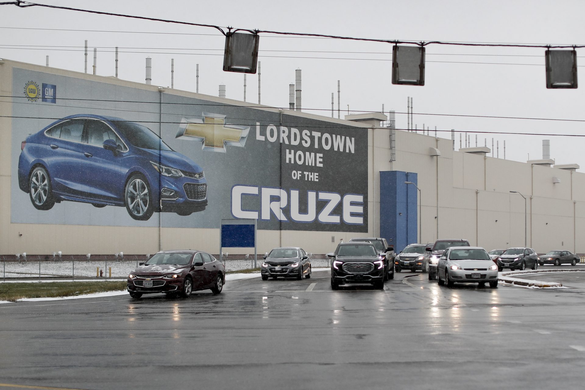 FILE PHOTO: In this Nov. 27, 2018, file photo a banner depicting the Chevrolet Cruze model vehicle is displayed at the General Motors' Lordstown plant in Lordstown, Ohio. An economic renaissance in the industrial Midwest promised by President Donald Trump has suffered in recent weeks in ways that could be problematic for Trump's 2020 re-election