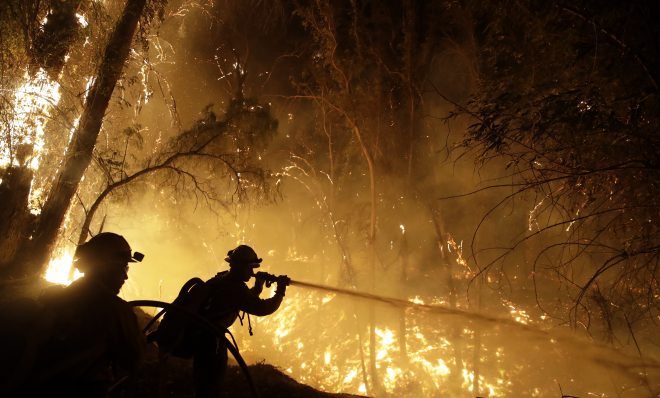 Firefighters battle the Maria Fire Friday, Nov. 1, 2019, in Somis, Calif. (AP Photo/Marcio Jose Sanchez)