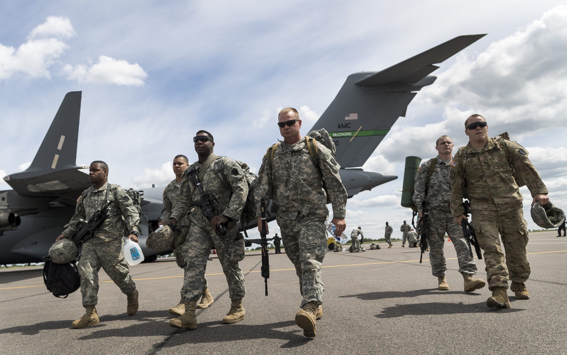 Members of the U.S. Army of the Pennsylvania National Guard arrival by plane at a airport in Vilnius, Lithuania, Sunday, June 5, 2016. US troops arrived Sunday in Lithuania to participate in NATO maneuvers.