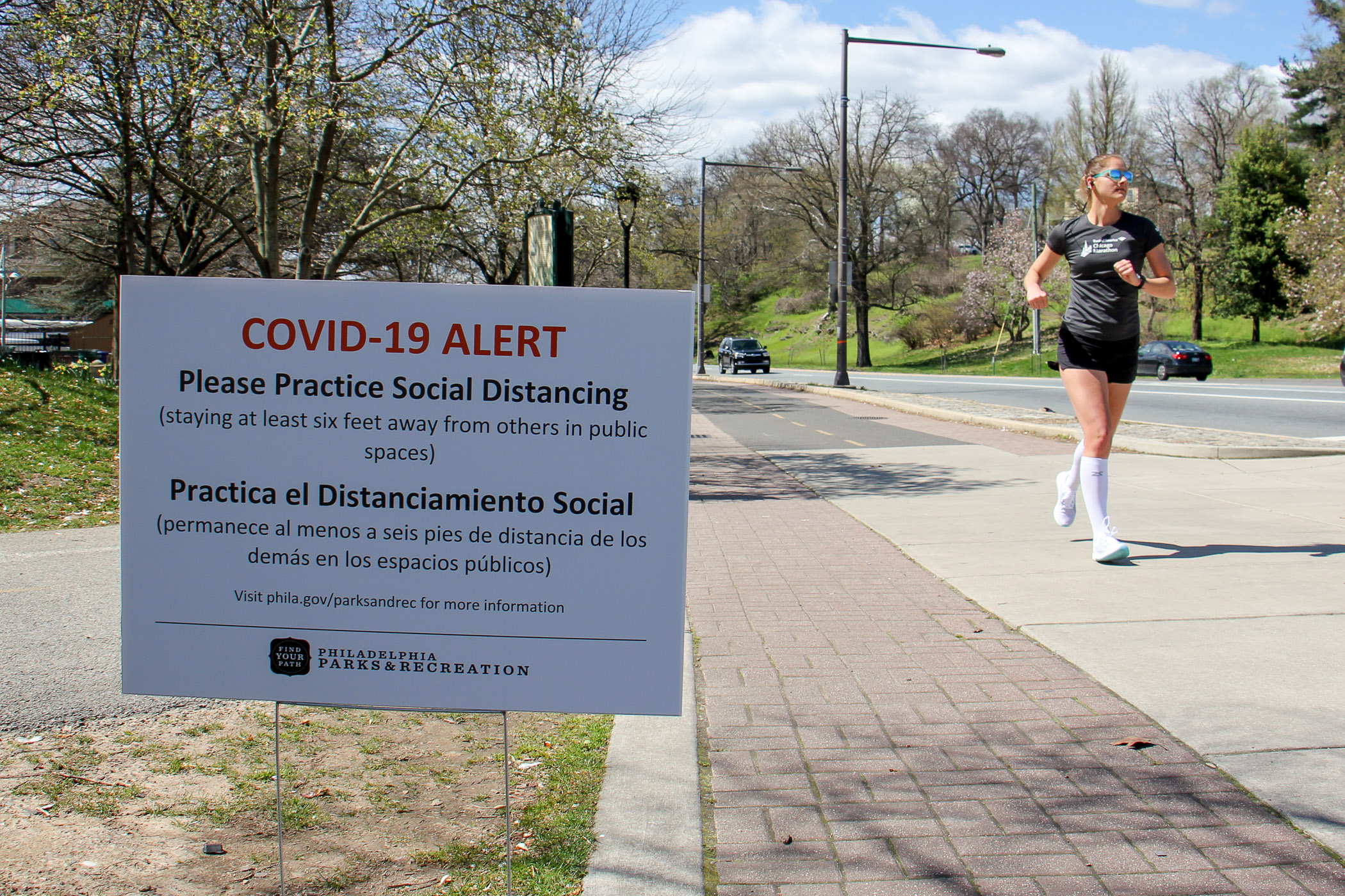 Signs posted along Philadelphia’s Schuylkill River Trail caution users to keep six feet away from others to prevent the spread of COVID-19.
