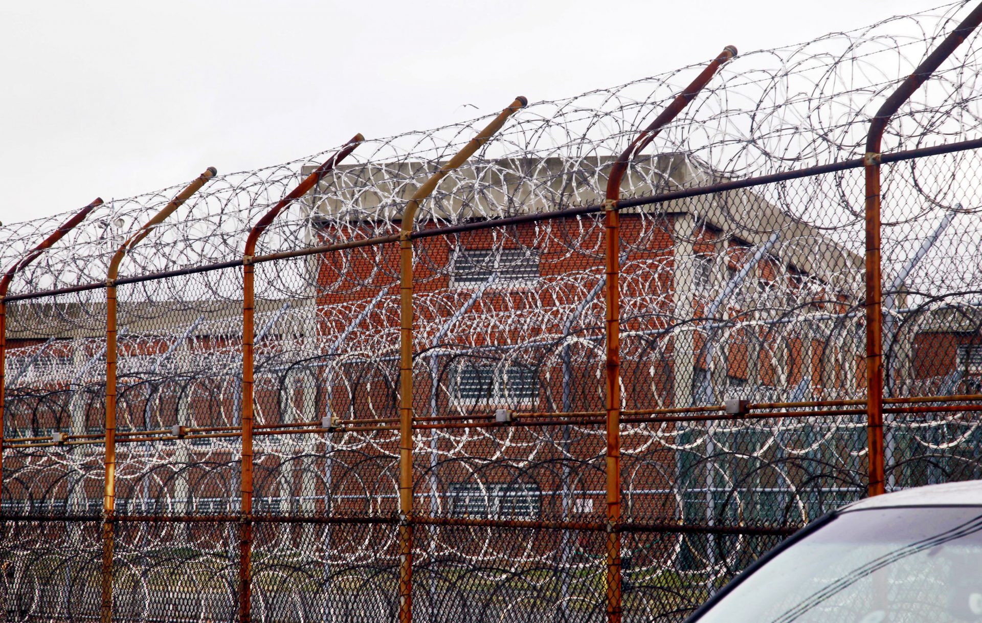 FILE PHOTO: In this March 16, 2011, file photo, a security fence surrounds the inmate housing on New York's Rikers Island correctional facility in New York.