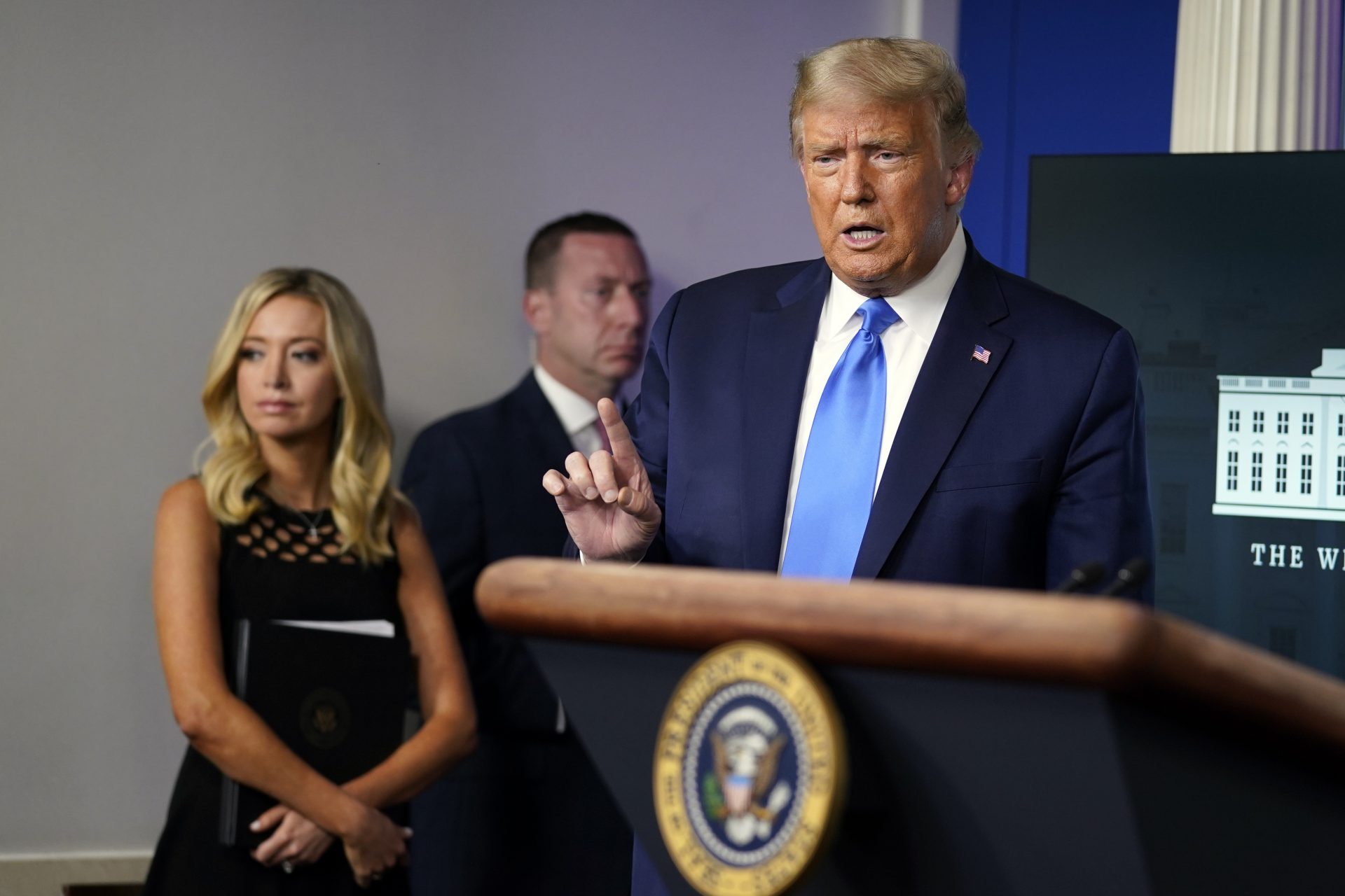 President Donald Trump speaks during a news conference in the James Brady Press Briefing Room of the White House Wednesday, Sept. 23, 2020, in Washington, as White House press secretary Kayleigh McEnany listens.