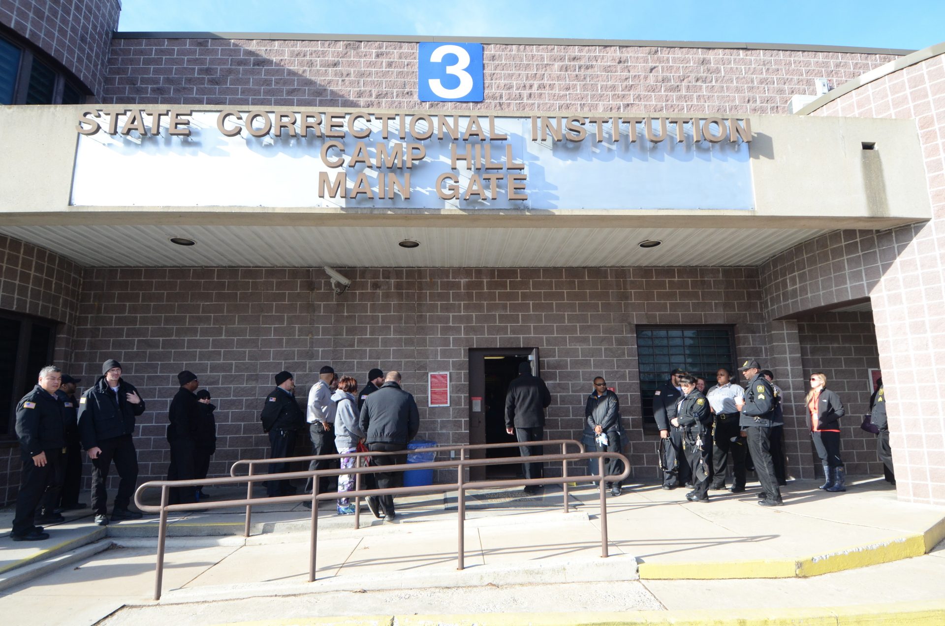FILE PHOTO: Corrections officers arrive for their shift at the State Correctional Institution at Camp Hill on Jan. 13, 2017, in Camp Hill, Pa.
