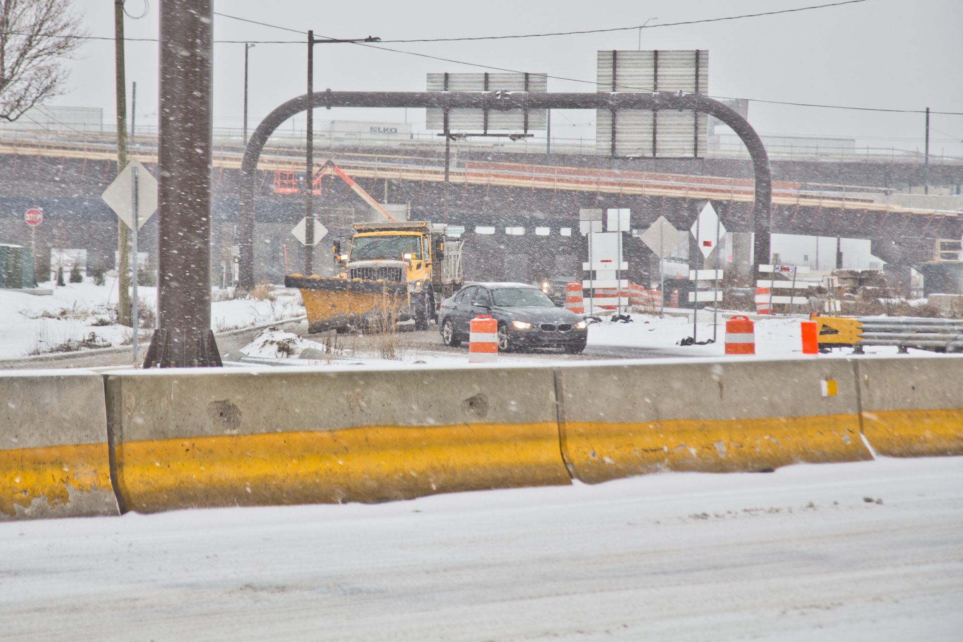 A PennDOT vehicle plows the entrance to 95 North in Philadelphia during a storm on Feb. 18, 2021.