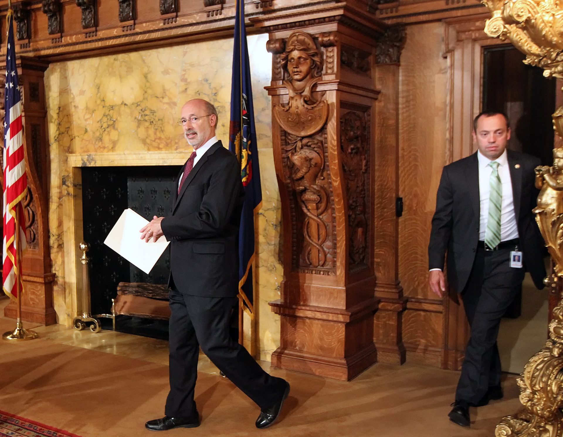 FILE PHOTO: Pennsylvania Gov. Tom Wolf walks out of his office on his way to speak to members of the media at the state Capitol in Harrisburg, Pa., Tuesday, June 30, 2015.  
