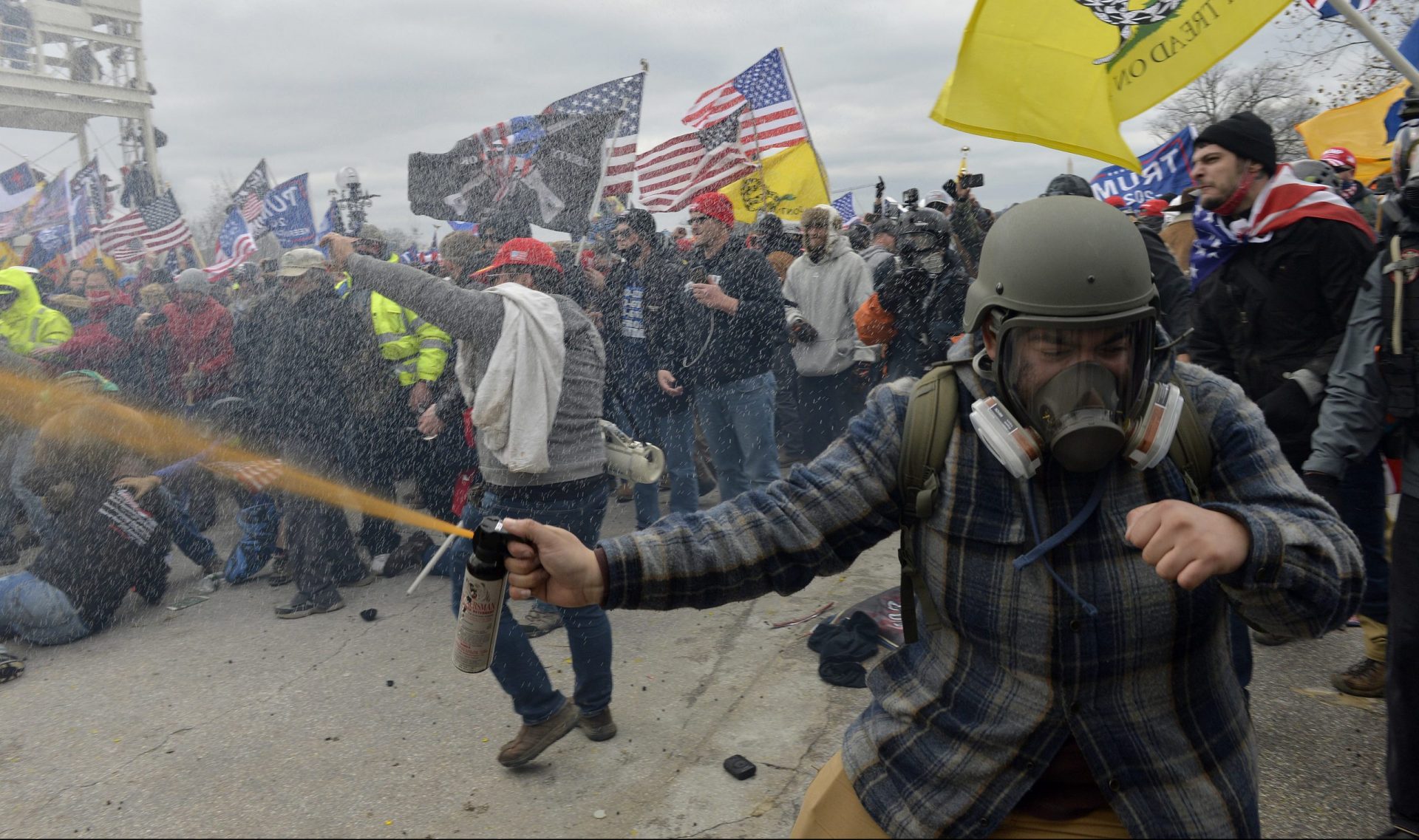 Pro-Trump extremists clashed with police during the storming of the U.S. Capitol on Jan. 6. The rioters may not have fired shots, but many were armed with other weapons, court documents show.