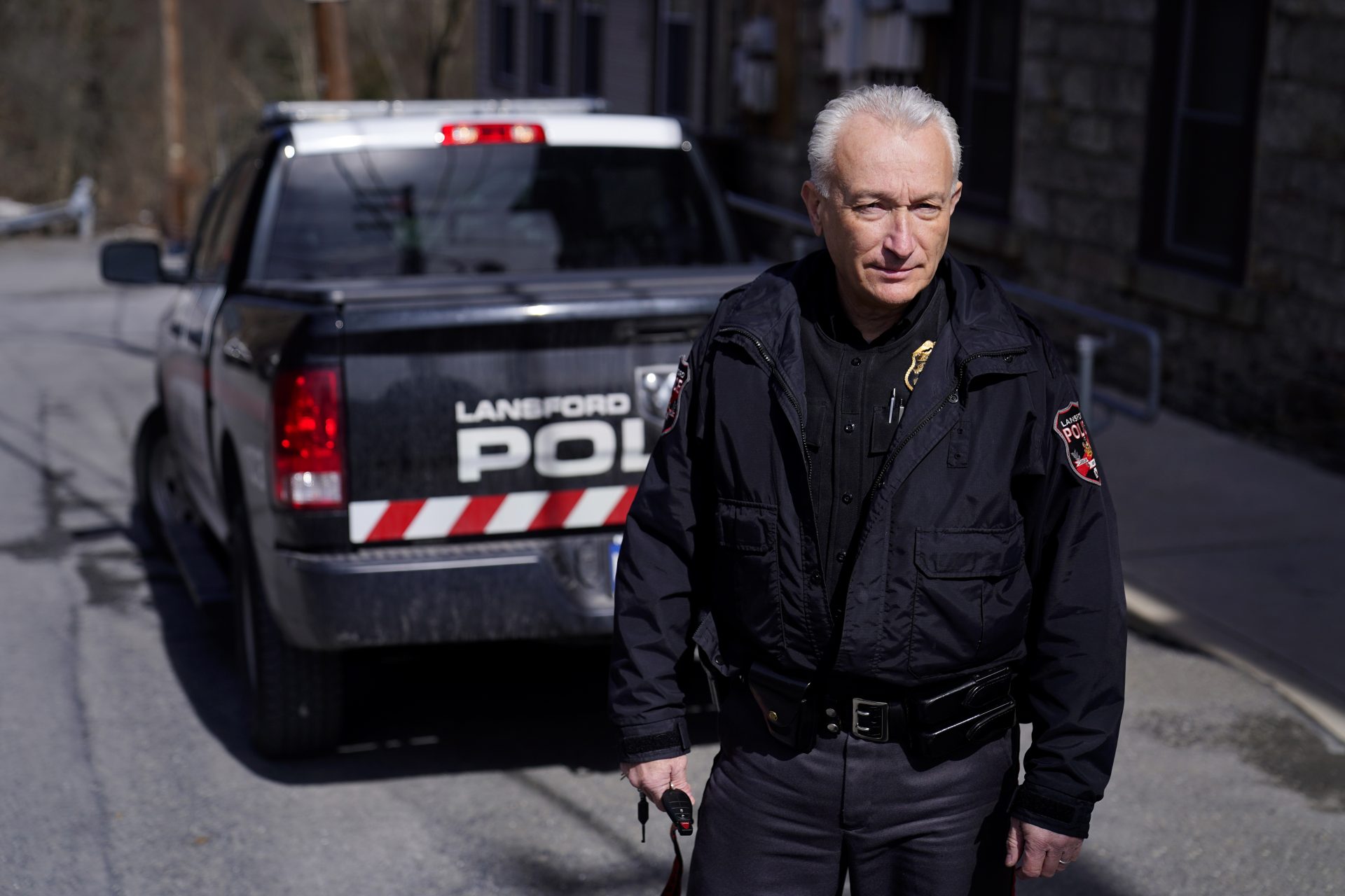 Lansford Police Chief Jack Soberick stands next to his truck, Friday, March 12, 2021, in Lansford, Pa. On May 26, 2020, police found 9-year-old Ava Lerario; her mother, Ashley Belson, and Ava's father, Marc Lerario, fatally shot inside their home. Soberick was the first to respond to the scene. "I don't believe this would have happened this way if not for the pandemic pushing him beyond the brink," Soberick said of Marc Lerario. "I wish Marc would have gotten treatment for the bipolar disorder."