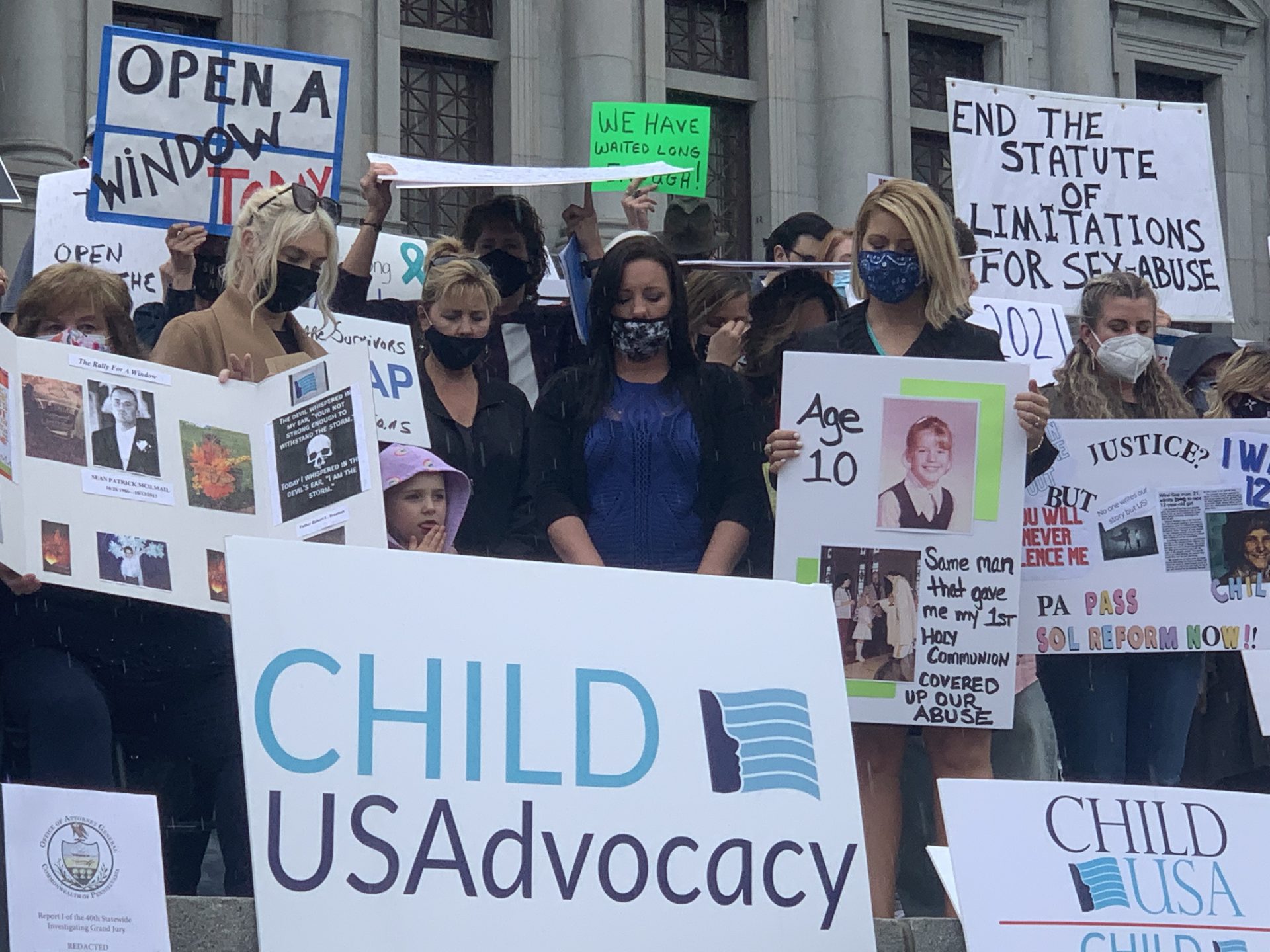 A crowd of demonstrators observe a moment of silence before rallying at the state Capitol on April 19, 2021 for a new two year window for survivors of childhood sexual abuse to sue their abusers.