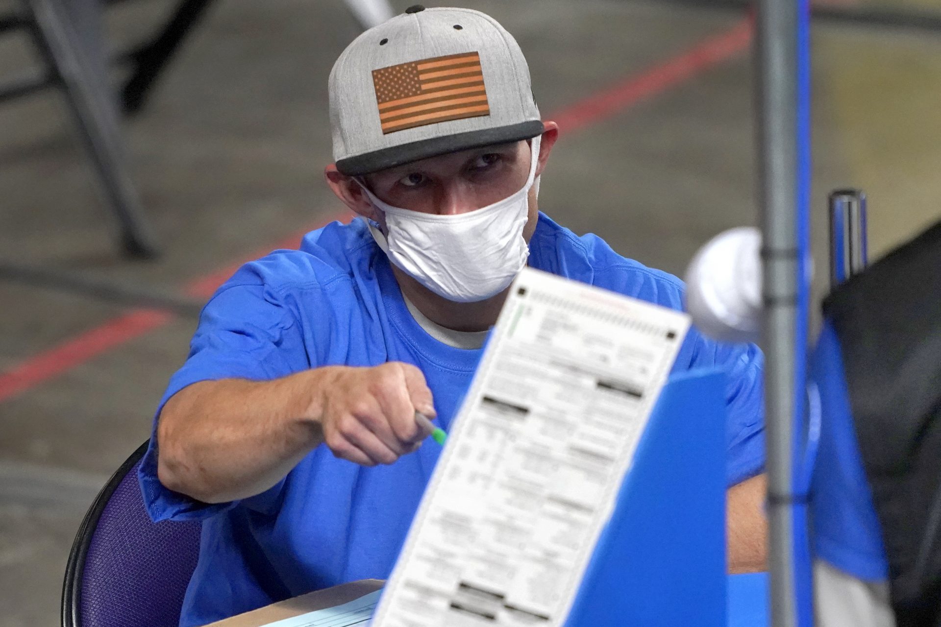 Maricopa County ballots cast in the 2020 general election are examined and recounted by contractors working for Florida-based company, Cyber Ninjas, Thursday, May 6, 2021 at Veterans Memorial Coliseum in Phoenix.
