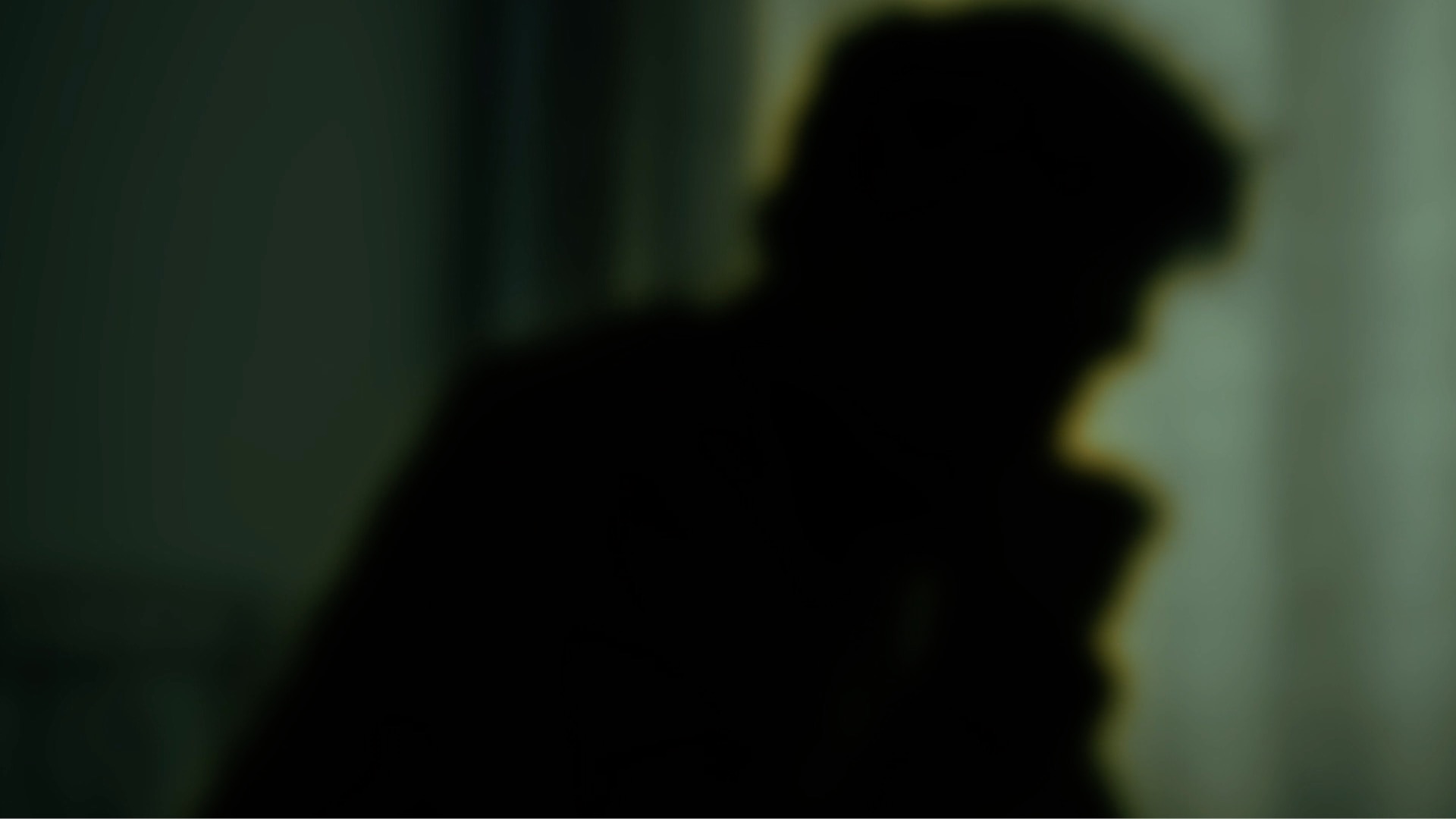 Blurry shadowy silhouette of a man