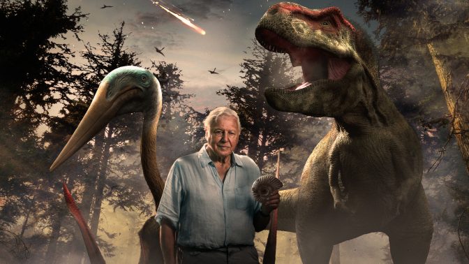 A man holding a fossil stands with a CGI of dinosaurs on their last day on earth