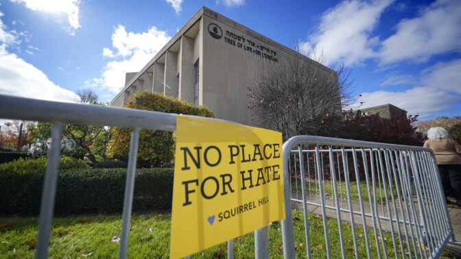 A sign hangs from a fence outside the dormant landmark Tree of Life synagogue in Pittsburgh's Squirrel Hill neighborhood on Thursday, Oct. 27, 2022, the fourth year since 11 people were killed in America's deadliest antisemitic attack.