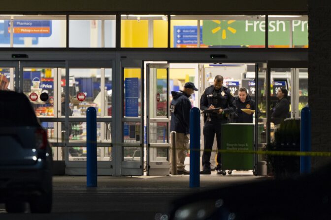 Law enforcement, including the FBI, work at the scene of a mass shooting at a Walmart, Wednesday, Nov. 23, 2022, in Chesapeake, Va