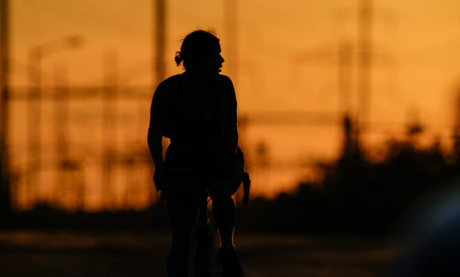 A cyclist rides in the day’s diminishing light, Wednesday, June 23, 2021, in Philadelphia,. 