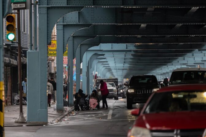People experiencing homelessness hung out north of Allegheny Avenue on Kensington Avenue after two blocks south of there was cleared by city officials on May 8, 2024. (Kimberly Paynter/WHYY)