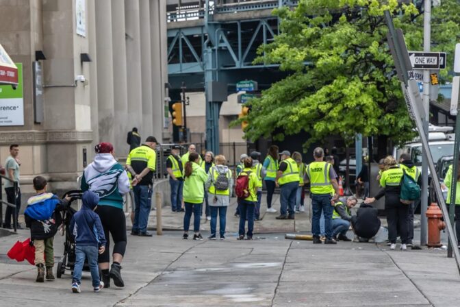 Outreach workers in Kensington tried to comfort a person who was yelling on Allegheny Avenue in Philadelphia on May 8, 2024. (Kimberly Paynter/WHYY)