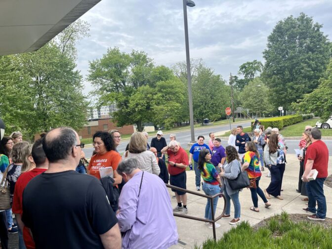 People gather outside of the Warwick school district office in anticipation of the May 7, 2024 Committee of the Whole meeting.