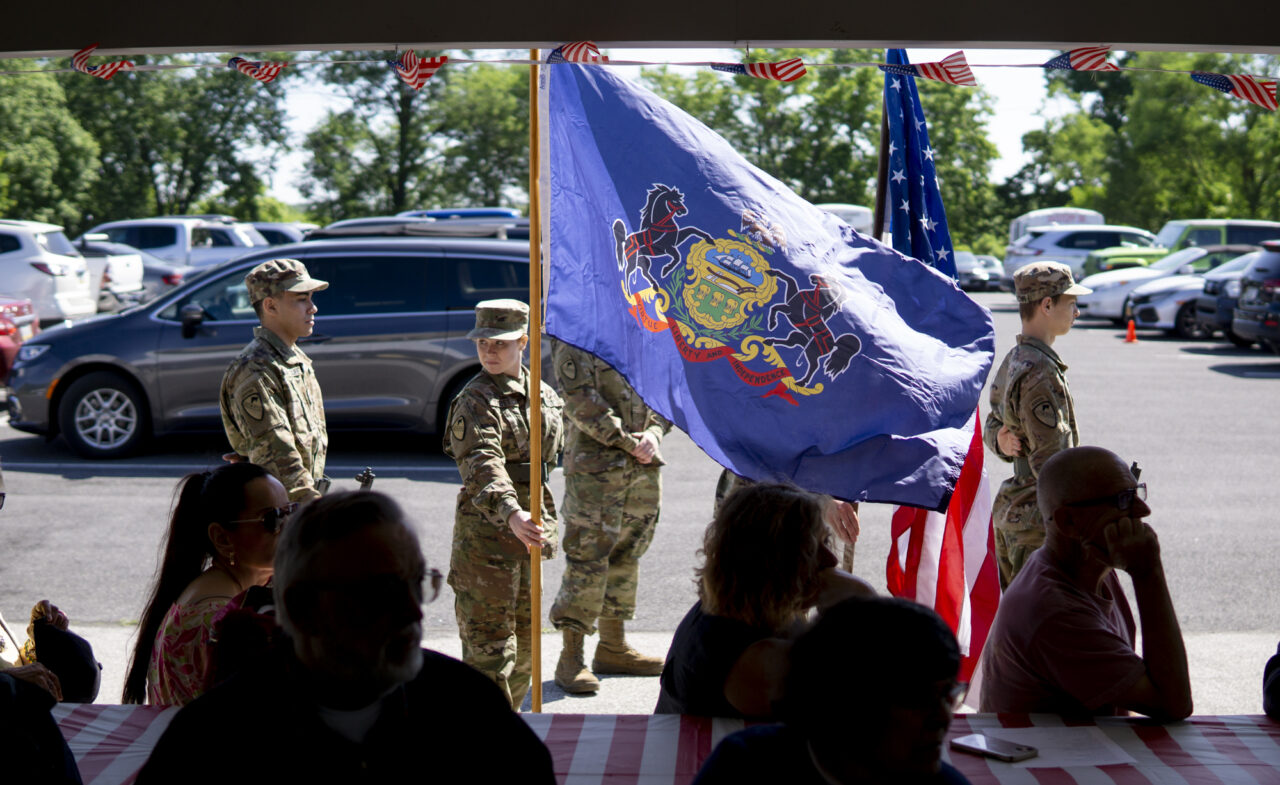 The Cedar Cliff JROTC prepares to presents the colors at a bridge dedication for SFC Randall Shughart in Newville on May 30, 2024. (Jeremy Long - WITF)