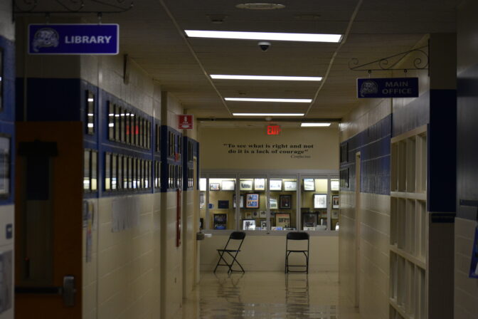 The OVSD high school hallway outside the board meeting, showing a Confucius quote, "To see what is right and not do it is a lack of courage." 