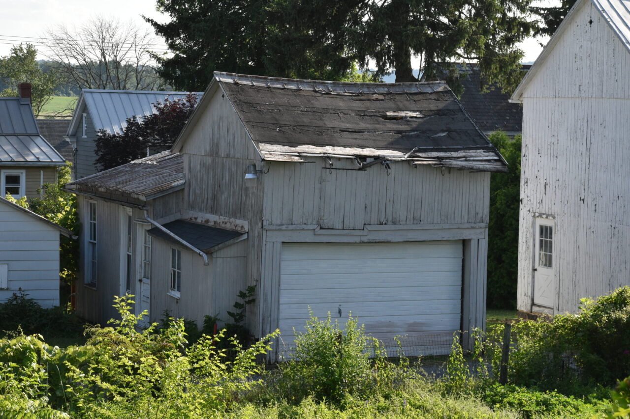 Oley Valley Board Member Christina Moyer's garage, painted white so the "Heil Hitler" and swastika that were visible before are now covered. The picture was taken from the Oley Valley parking lot. Pictured on June 12, 2024.