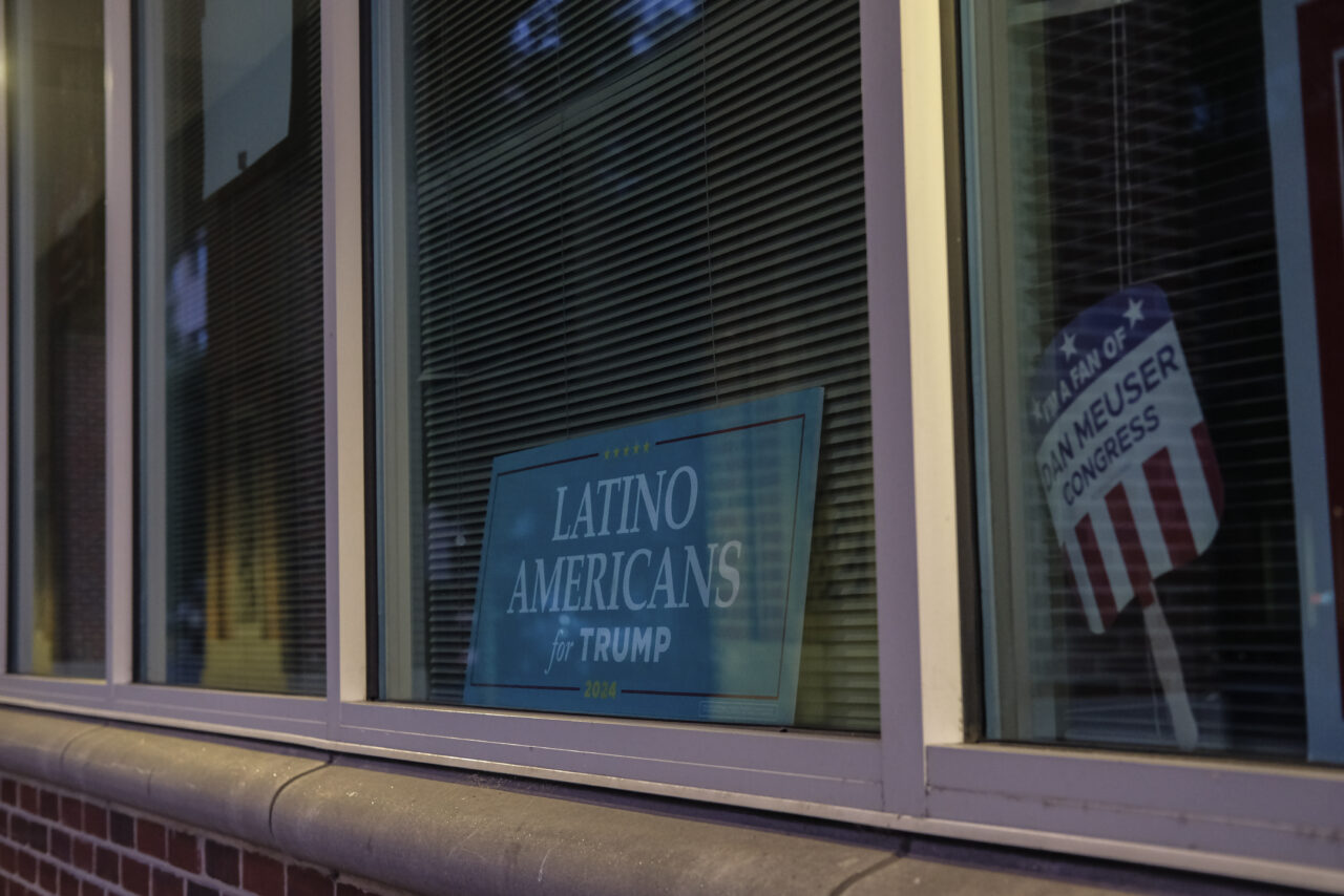 A sign is displayed at the "Latino Americans for Trump" office in Reading, Pa., Sunday, June 16. Political candidates are taking notice of Reading's economic and political power. The 2020 presidential election in Pennsylvania was decided by about 82,000 votes, and — according to the Pew Research Center — there are more than 600,000 eligible Latino voters in the state. (AP Photo/Luis Andres Henao)