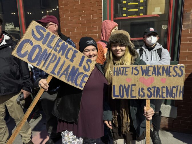 Laura Martin, left, a Mechanicsburg Borough Council member, with her child Jupiter Martin at the "No Hate Here" rally in Mechanicsburg on Oct. 29, 2025.