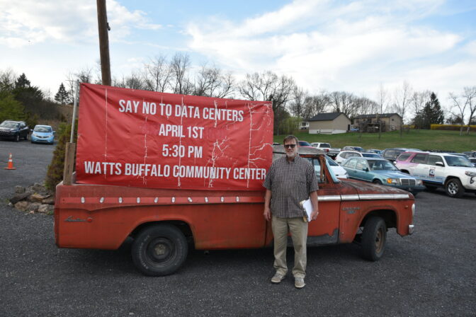 Daniel Welliver, part of a group of local residents opposing data center development in Watts Township without strict ordinances in place, stands by his truck at the Watts-Buffalo Community Center on April 1, 2026.