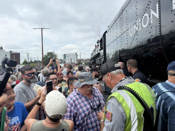 Big Boy operator Ed Dickens give out his signature to train enthusiasts in Lebanon, PA, on July 7, 2026. 