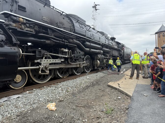 Thousands watch as the world's largest operating steam-powered train, Big Boy 4014, stops at a railway station in Lebanon, PA, on July 7, 2026.